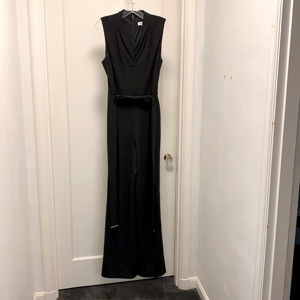 Black sleeveless jumpsuit with tie belt